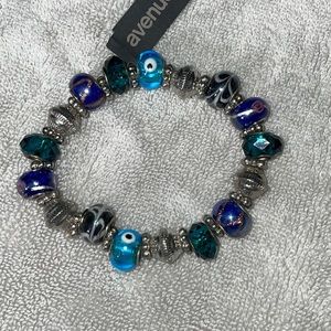 NWT. Stretch Bracelet. Beautiful Green, Blue,and Silver Beads.